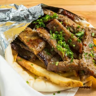 Gyro Shawarma. (Potatoes, Garlic Sauce, & Parsley)