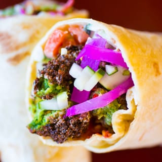 Veggie Falafel Wrap. (Hummus, Tomatoes, Cucumbers, Parsley, Tahini Sauce, & Pickled Turnips)
